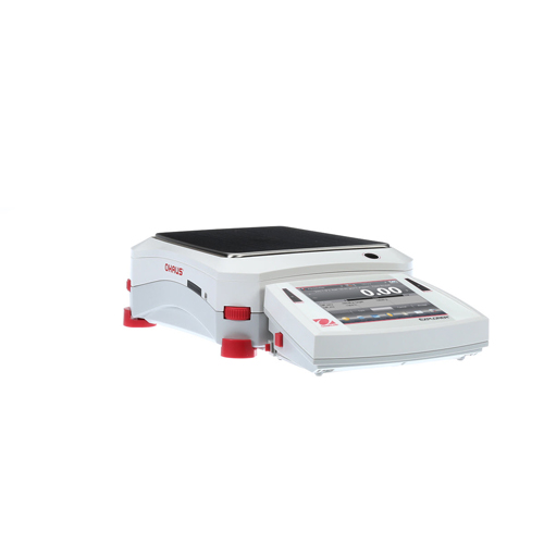 a white electronic scale with red feet