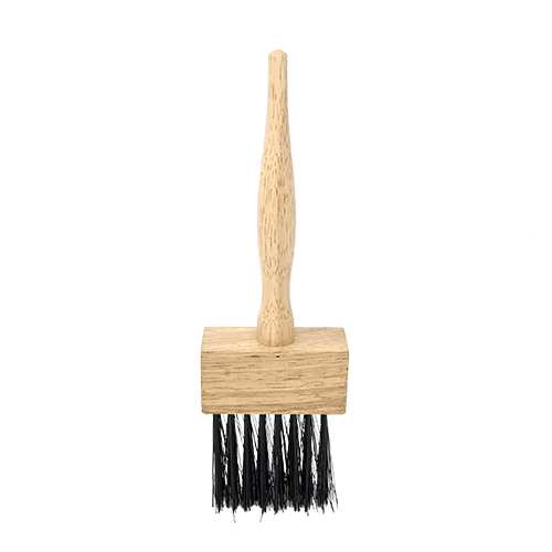 An NCAT basket brush viewed from the front slightly angled down. This angle shows the rectangular base and handle with the bristles below the base