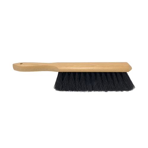 side mage of a table brush with a wooden handle and black bristles